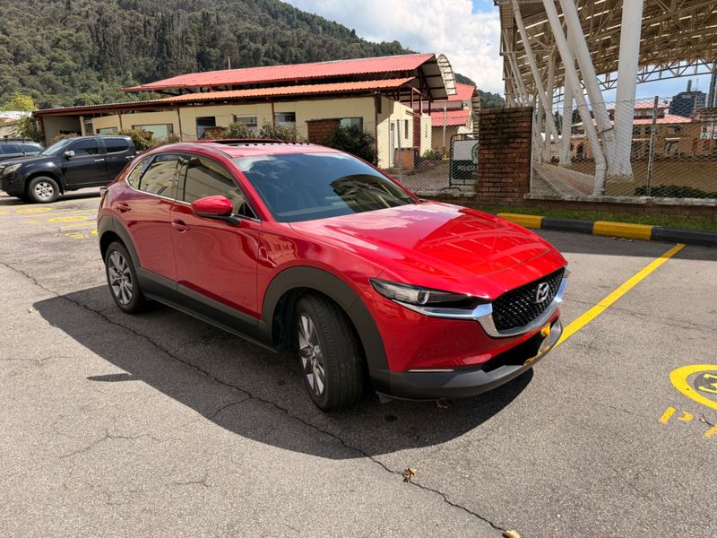 MAZDA CX30 GRAND TOURING LX HÍBRIDA 2025 Vehículo prácticamente nuevo 4.000km. Una SUV de última generación diseada para quienes buscan tecnología híbrida eficiencia y un diseo moderno y elegante. Una oportunidad única de estrenar sin pagar de más - imagen 1